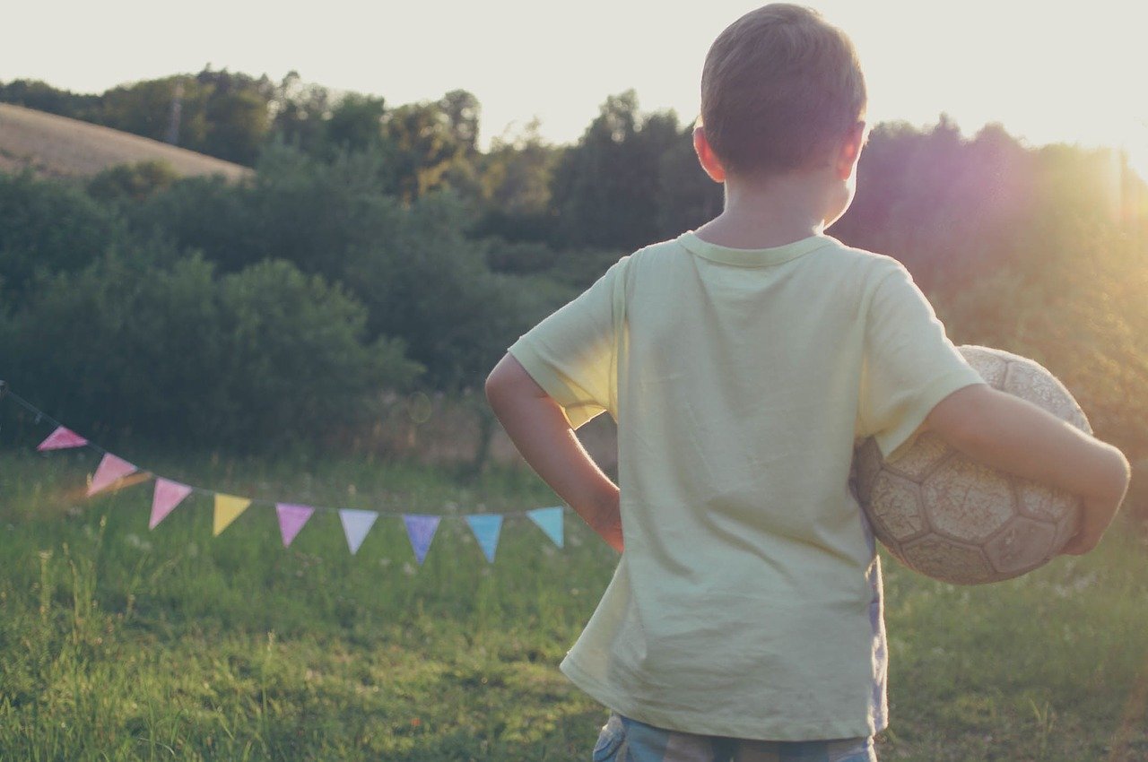 5-year-old holding football
