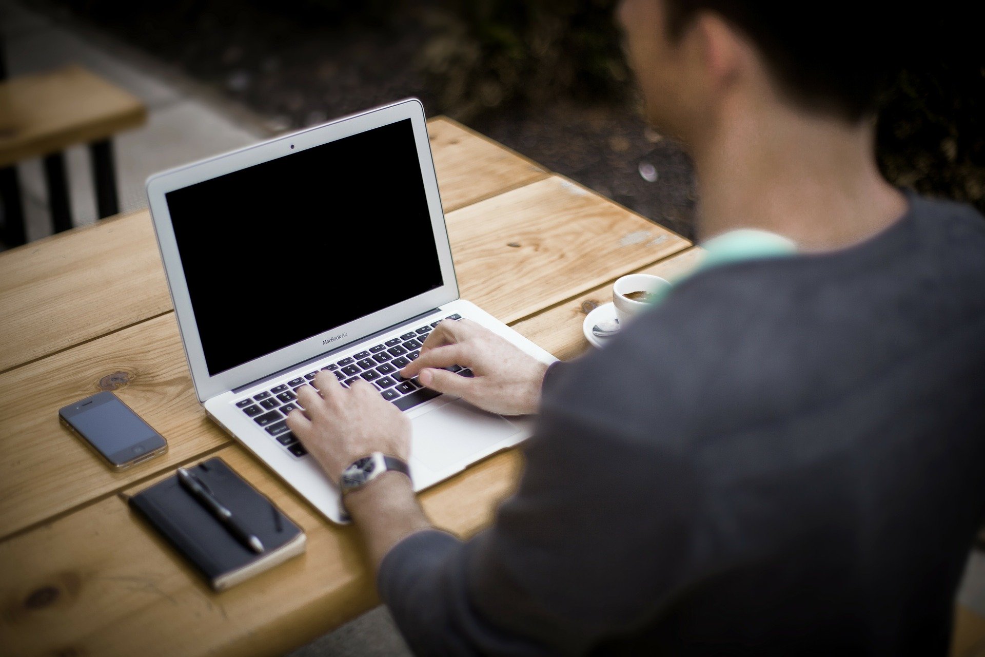 man working from home but screen is black