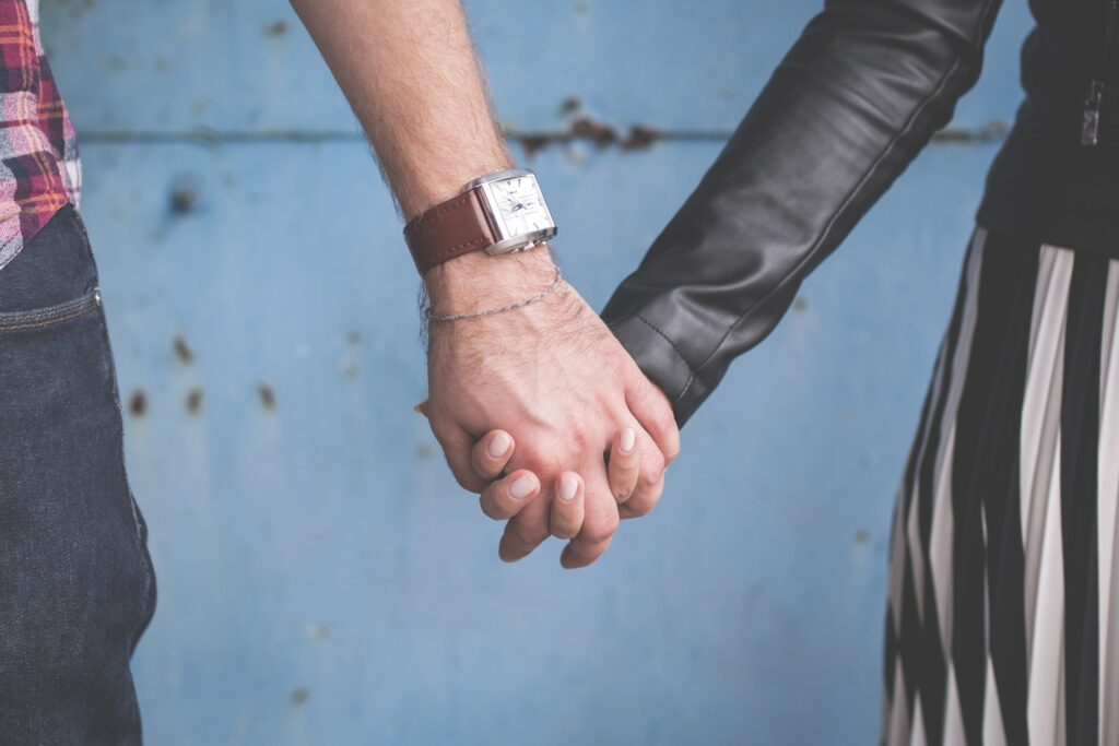 close up of couple holding hands