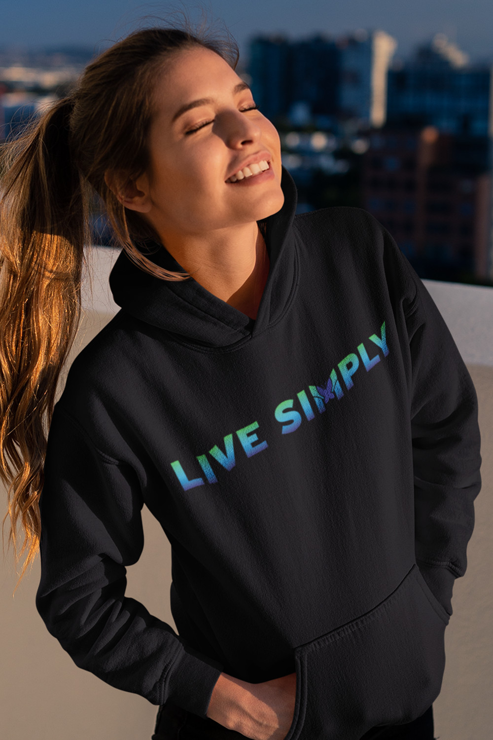 woman in hoodie looking pleased with herself