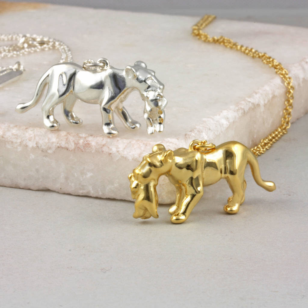 close up of pendant - lioness carrying cub