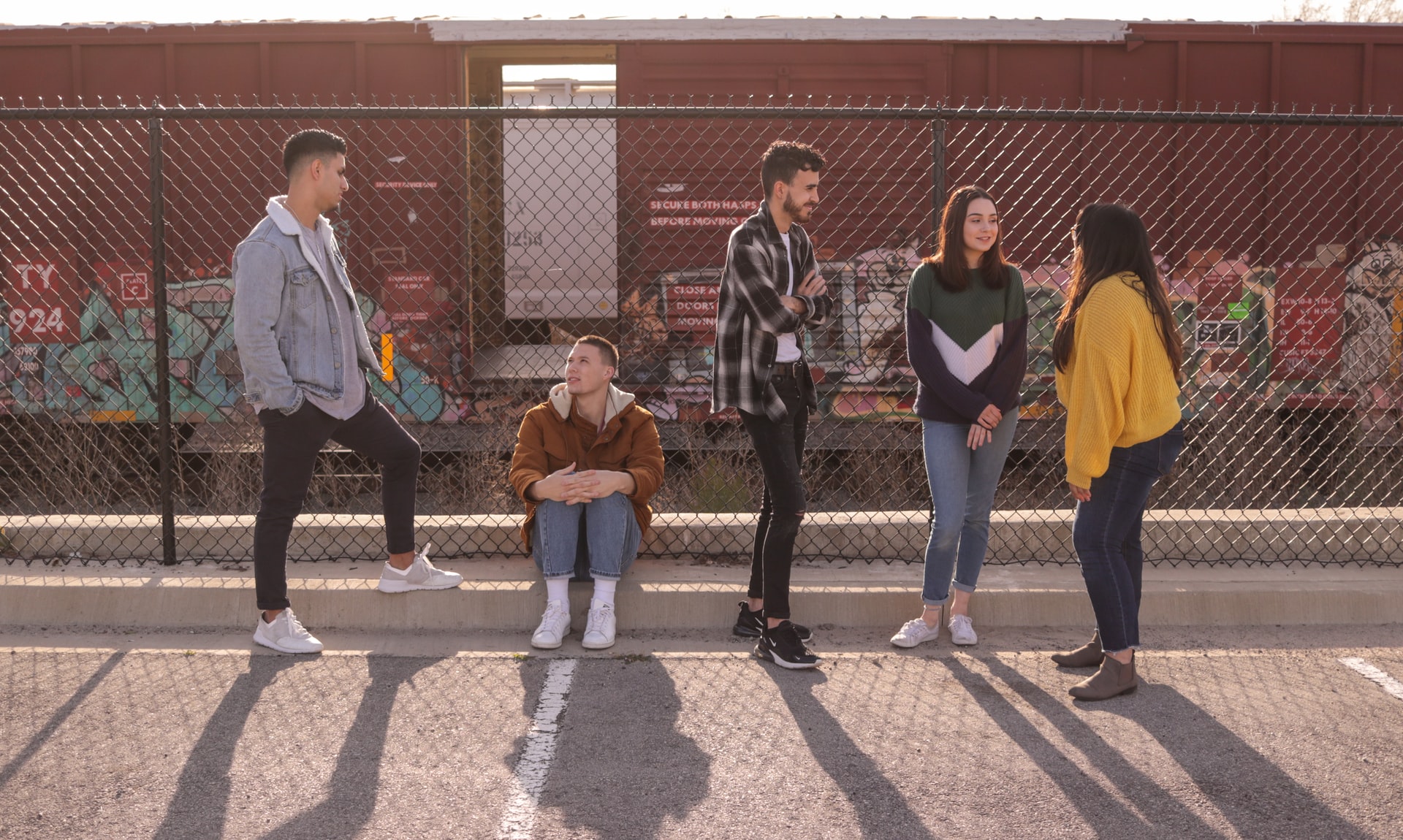 group of teens hanging out together outside