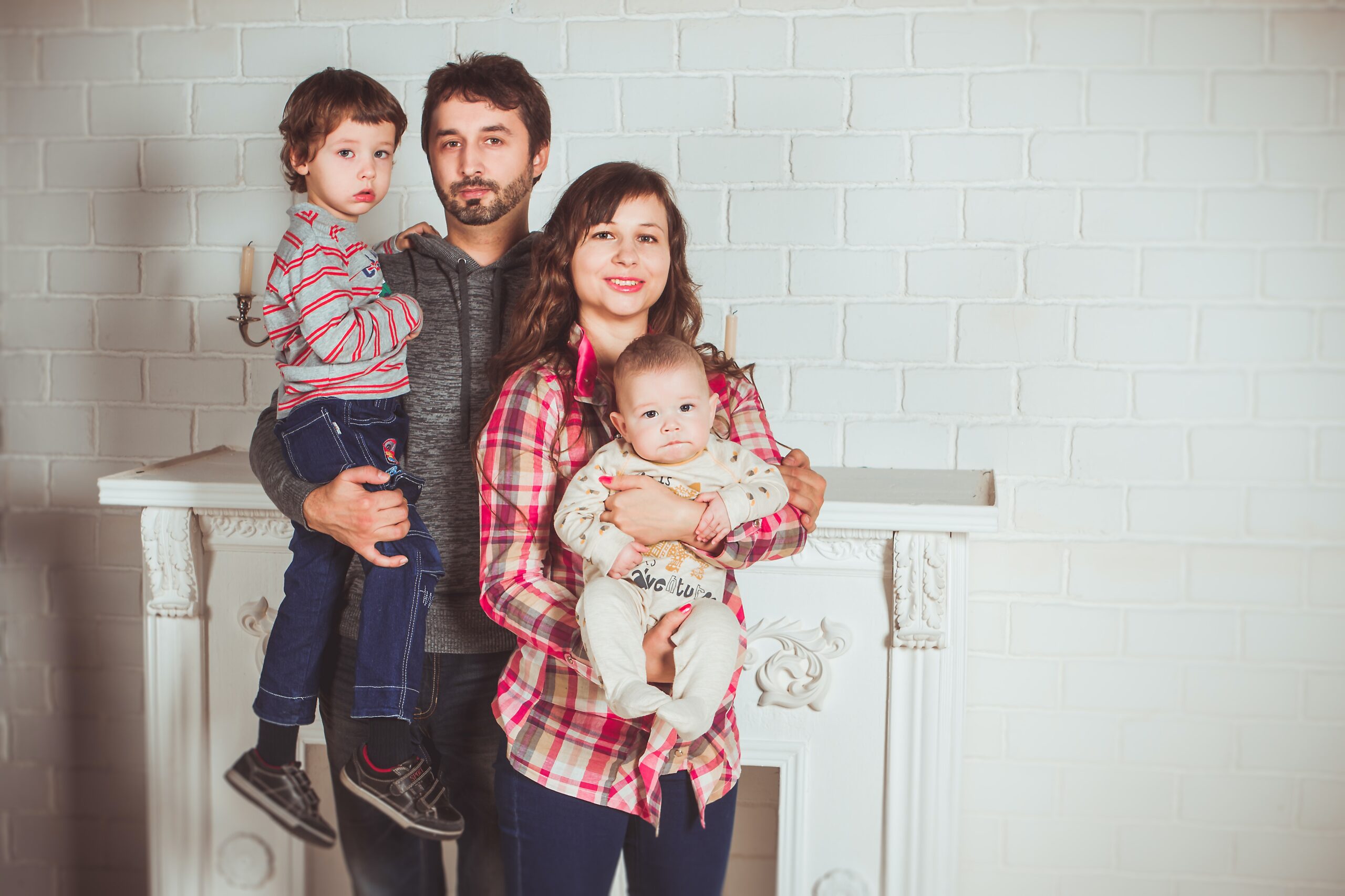 family in front of fireplace