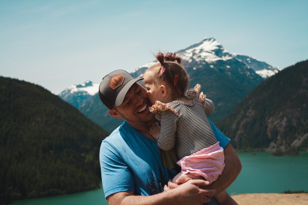 man holding small daughter