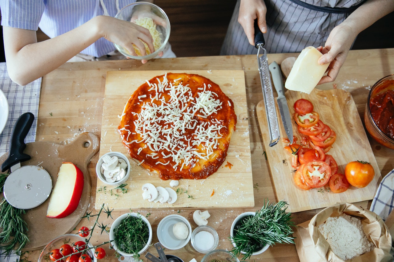 Pizza making is a great playdate idea for 6 year olds