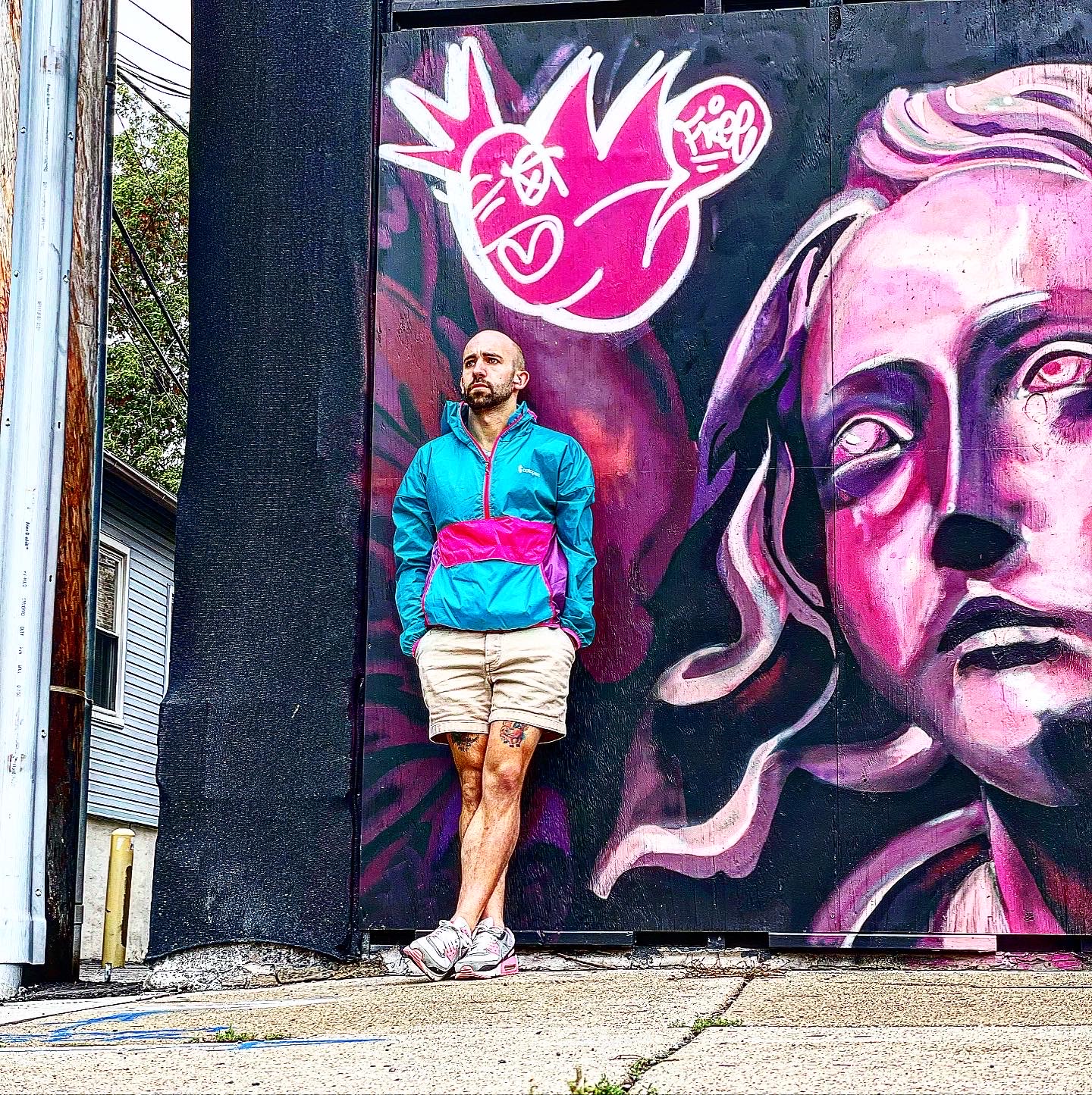 jack dawkins in front of mural