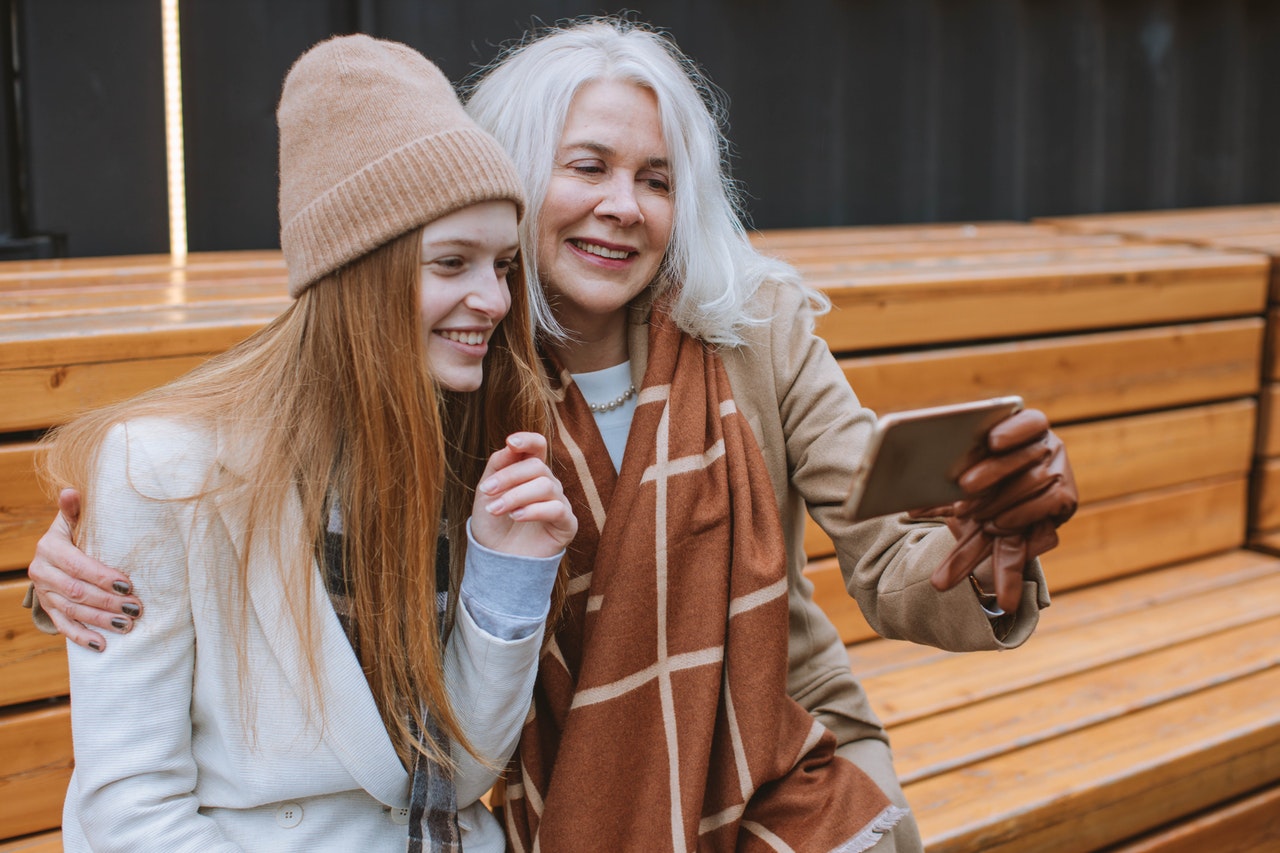 woman and teen taking selfie