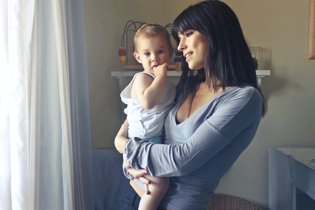 mother holding baby