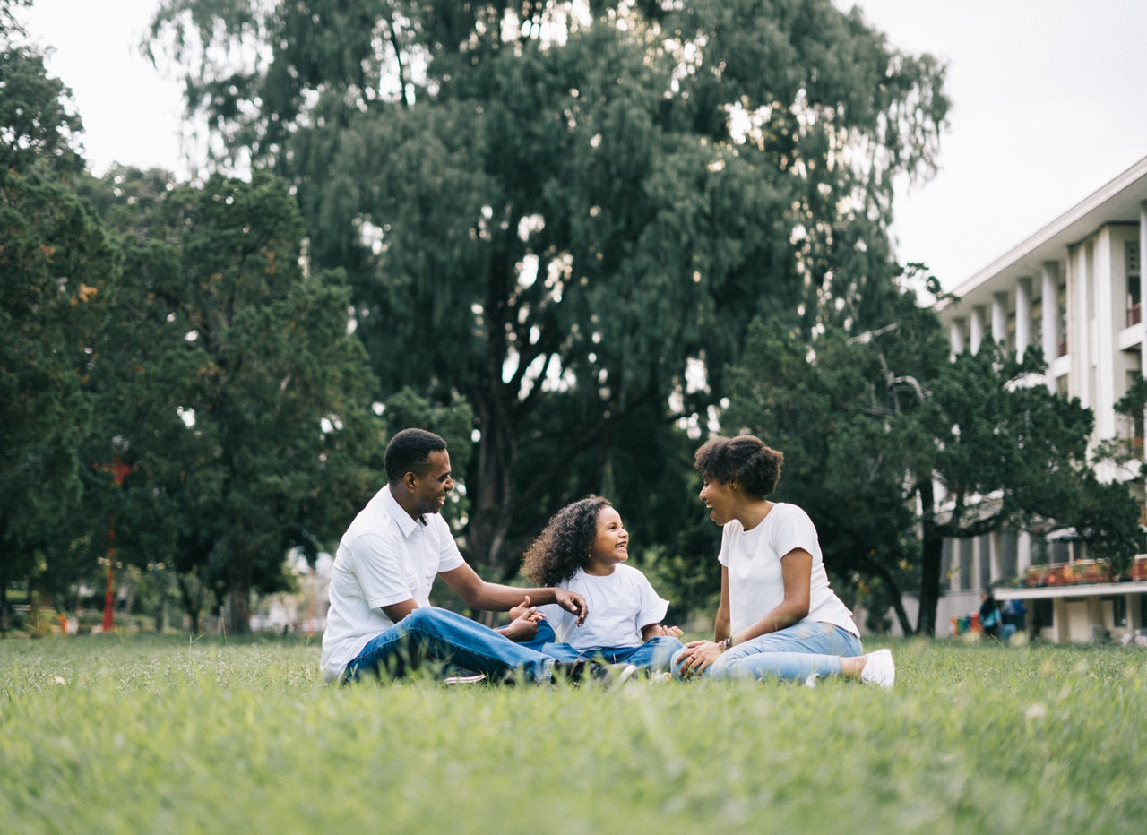 family sat on lawn