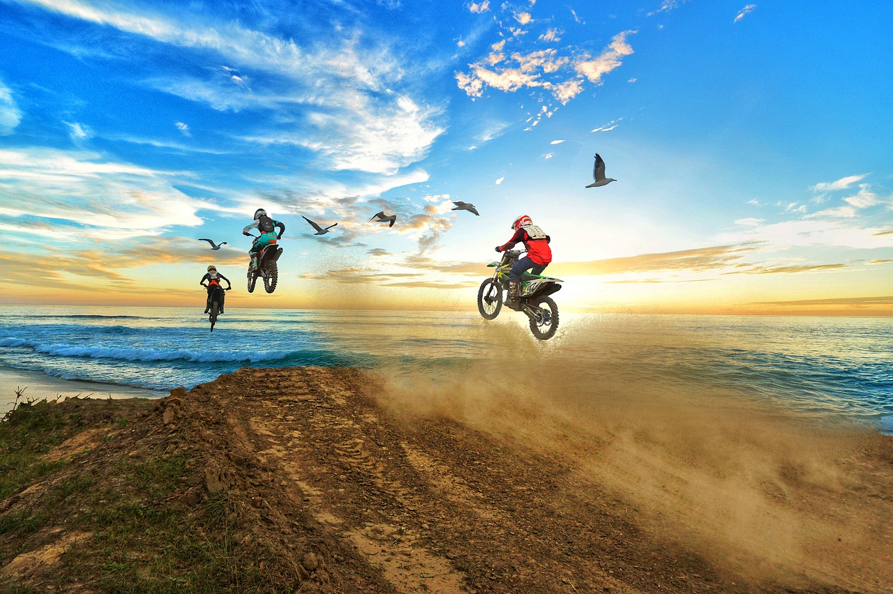 dirt bikes going over mound