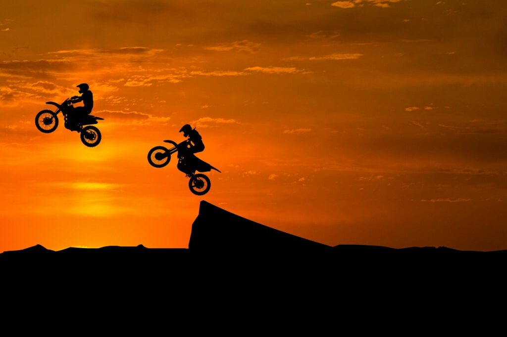 dirt bikes in sunset