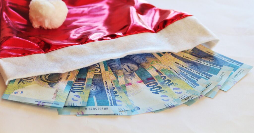 money in a santa hat