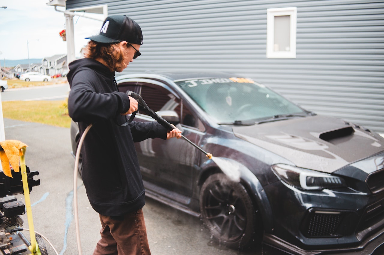 guy washing car