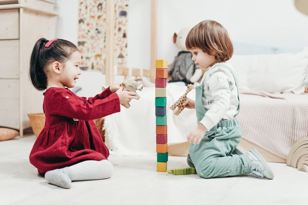 kids playing on carefully chosen playroom flooring