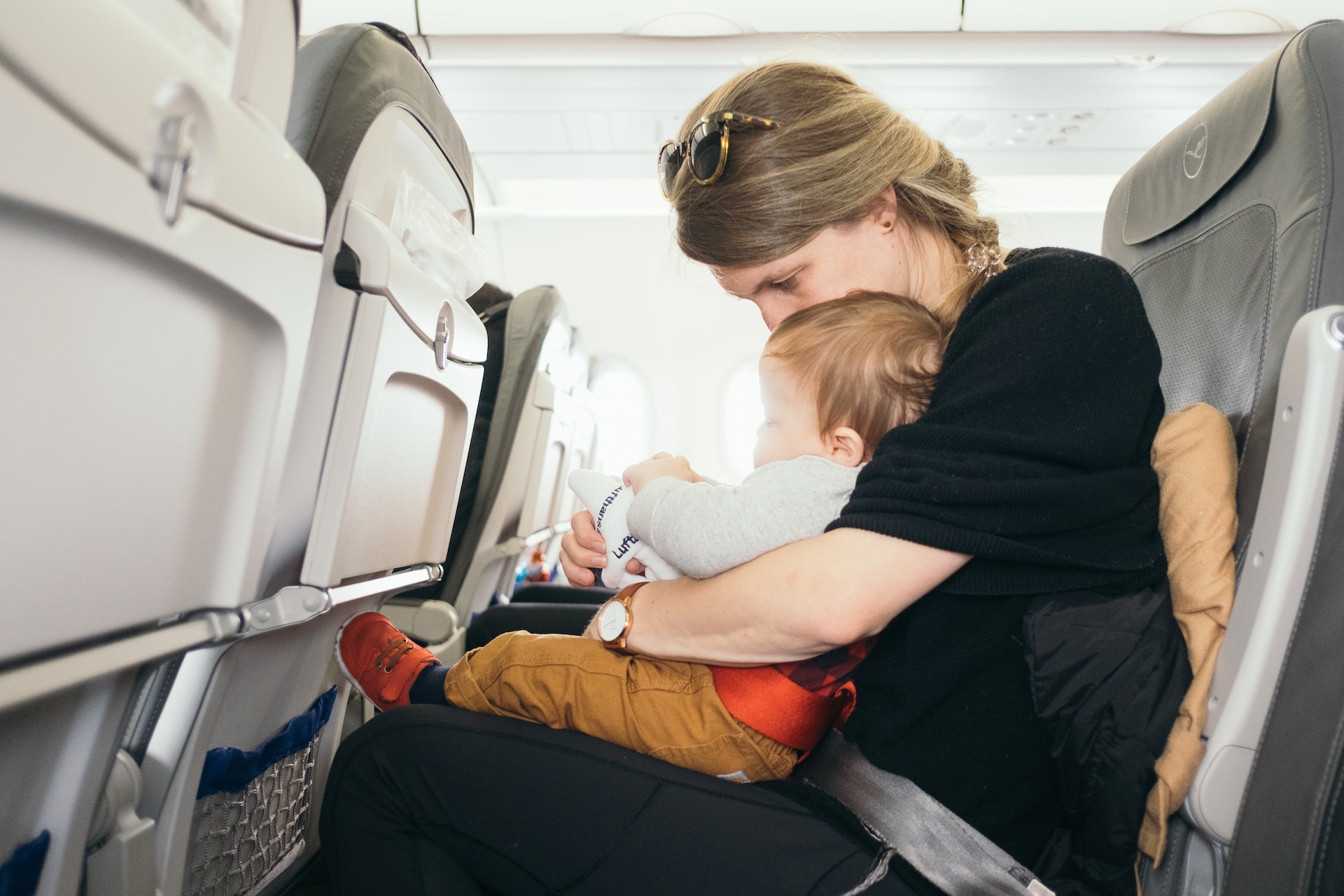 mother and baby on plane