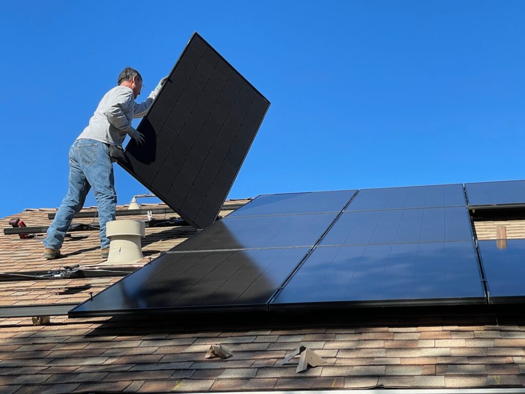 guy installing solar panels