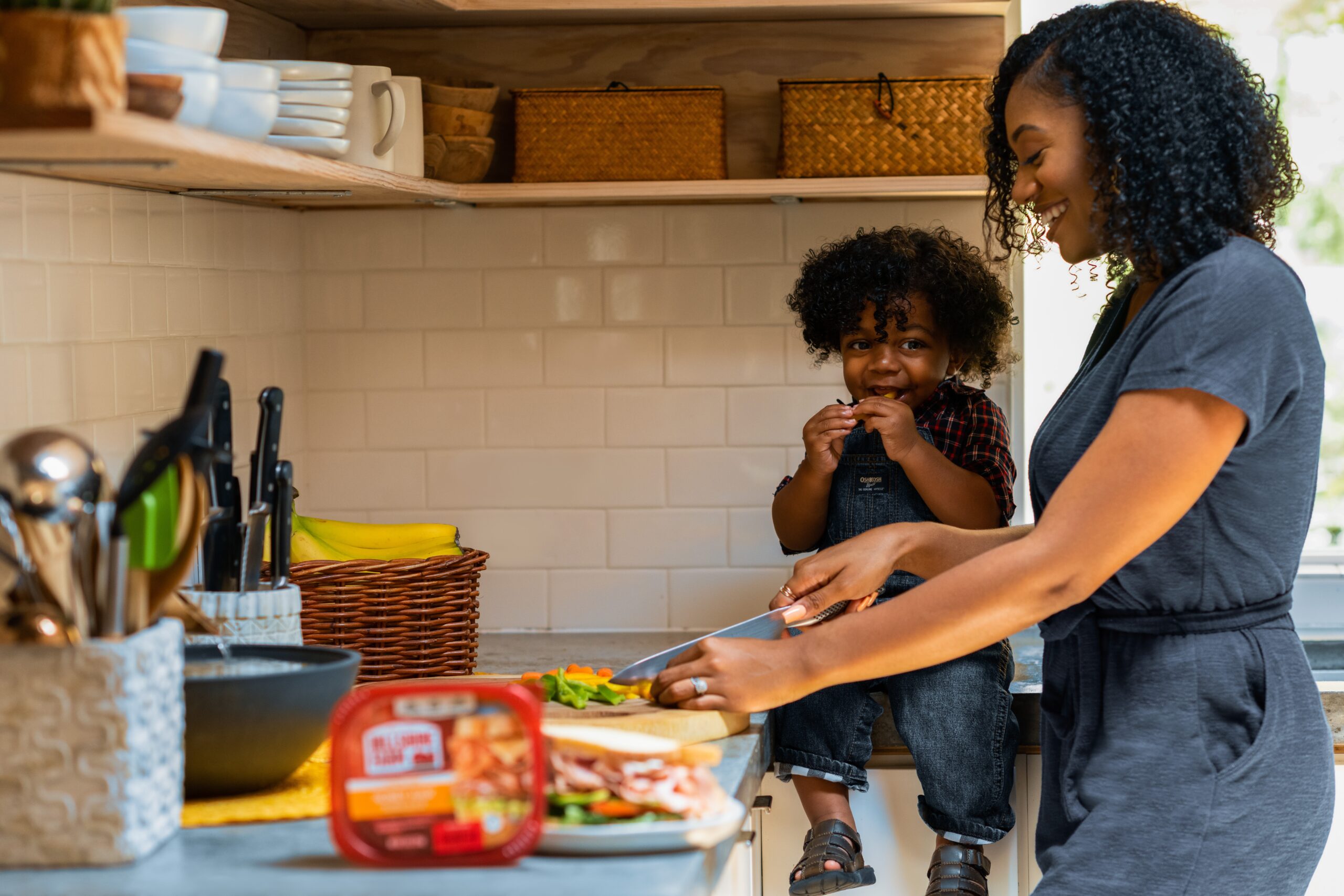 child helping prepare food