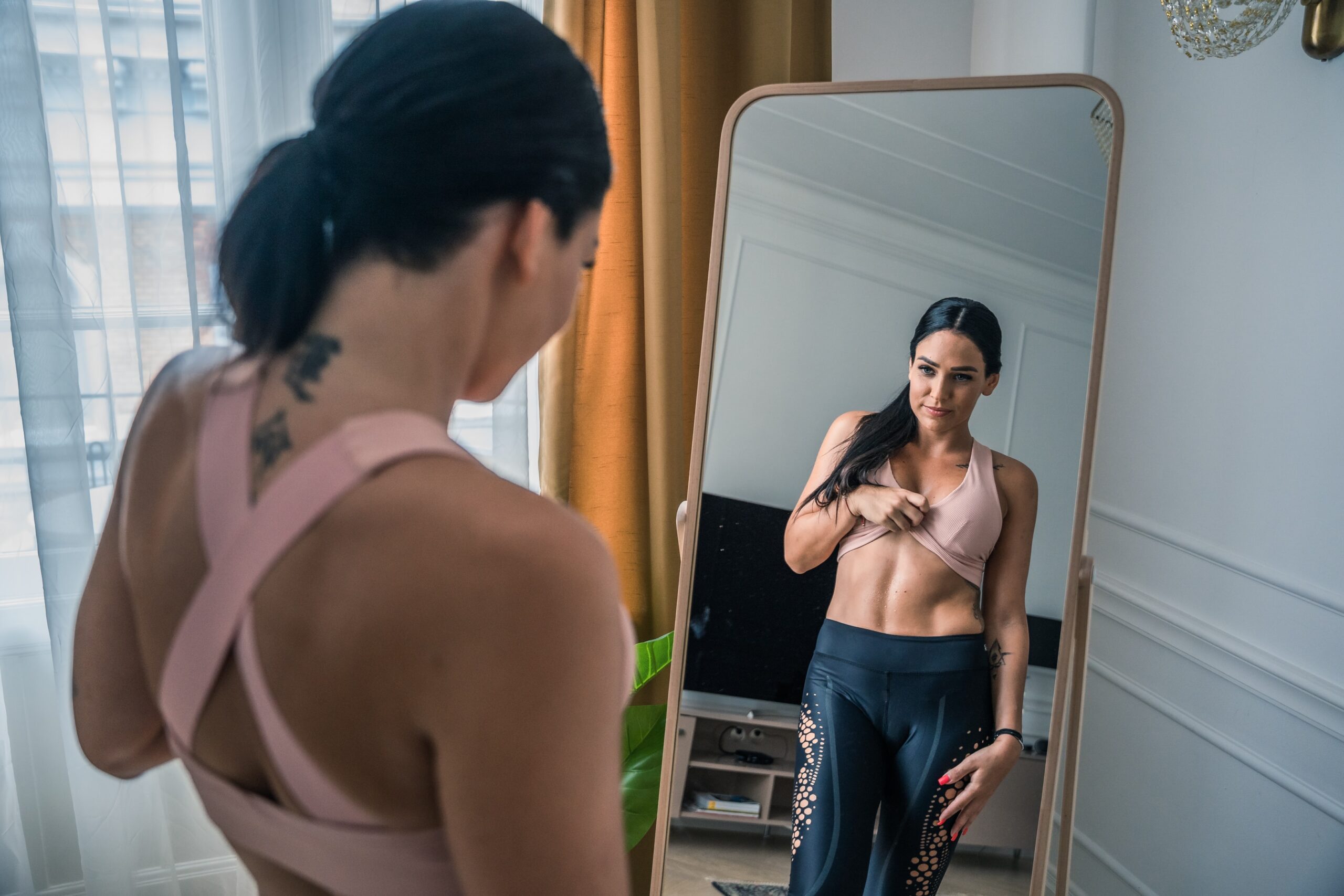 woman looking in mirror