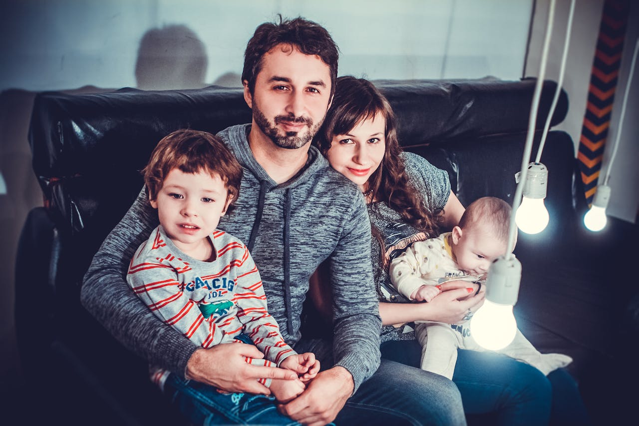 family sitting on a sofa